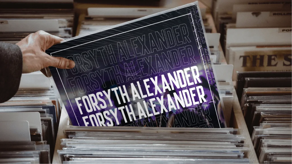 Image of a row of records. A hand pulls out one record from the pile that reads "Forsyth Alexander"
