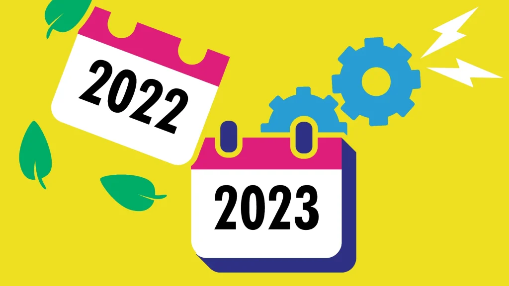 image of a paper calendar. The 2022 page is being removed, showing just the 2023 page