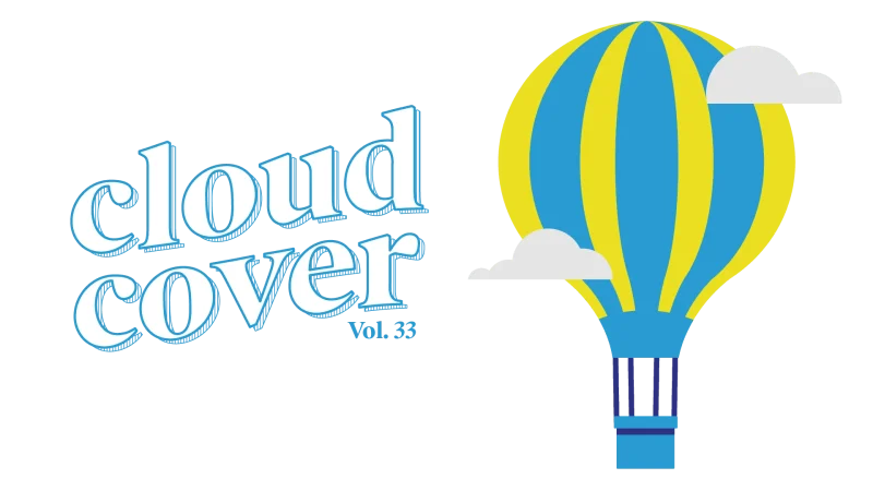 Image features bold white text reading "Cloud Cover, volume 33" on the left side. On the right side of the image is a hot air balloon, with yellow and blue stripes. The hot air balloon is surrounded by clouds indicating it's in the air and flying.
